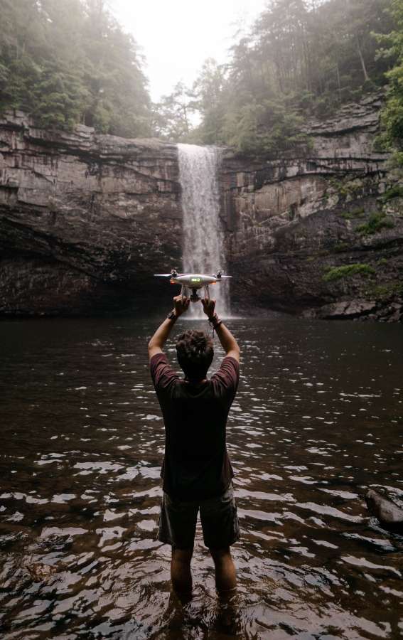 drone, holding, young, water, vacations, tourism, inhale, calm, enjoyment, fresh, relaxation, nature, tree, oxygen, waterfall