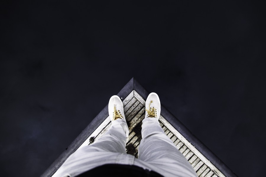 concept, one person, people, man, precipice, end, edge, fall, black background, shoe, shoes,