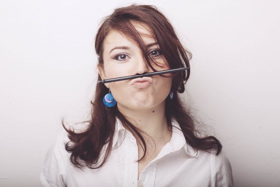 splitshire, one person, people, woman, looking at camera, front view, young, pencil, office, business, gesture, funny, funny concept,