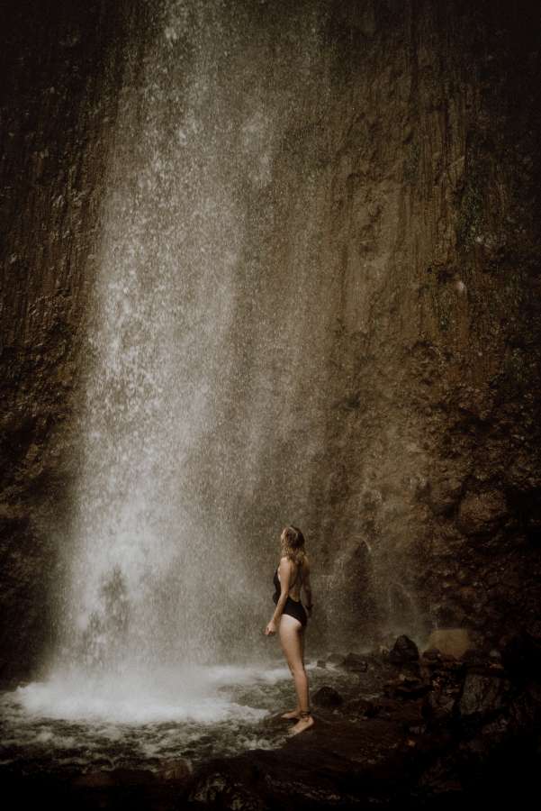 falling, popular, famous, skogafoss, waterfalls, steam, waterfall, alone, scandinavia, world, fall, nature, one, travel, sprayed, under, landscape, open, attraction, magical, wet, iceland, people, lifestyle, tourist, summer, landmark, up, water, adventure, falls, enjoying, amazing, view, wonders, person, woman, tourism, winter, mountains, arms, circle, fog, happy