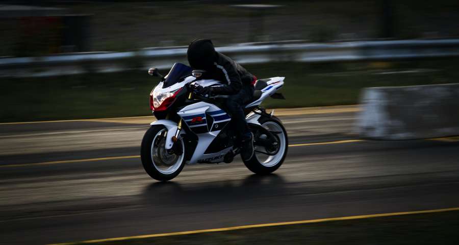 road, transport, biker, sport, man, travel, motorbike, speed, people, motorcyclist, transportation, motorcycle, motor, drive, motion, rider, vehicle, freedom, race, outdoors, journey, bike, ride, adventure, lifestyle, view, power, jacket, wheel, fun, sunset, light, asphalt, sun, street, countryside, green, blue, leisure, safety, background, break, excursion, cloudscape, driving, copyspace, copy space, motorcycles