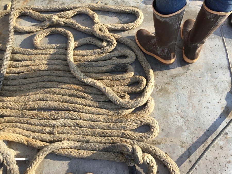 one person, people, man, boot, boots, sailor, rope, string, port work,