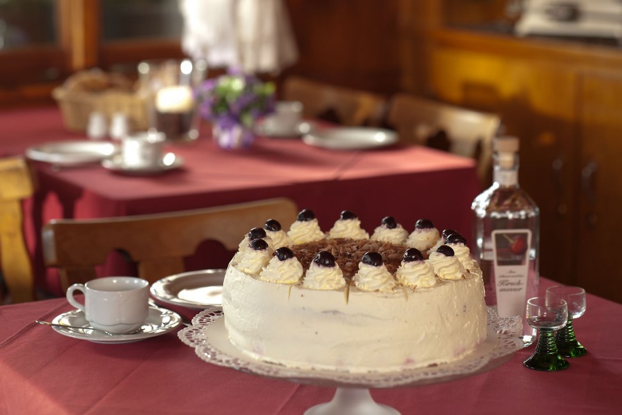 cream, candy, cake, pie, restaurant, presentation, dessert, liqueur, bottle, table, interior, bar, nobody, food,